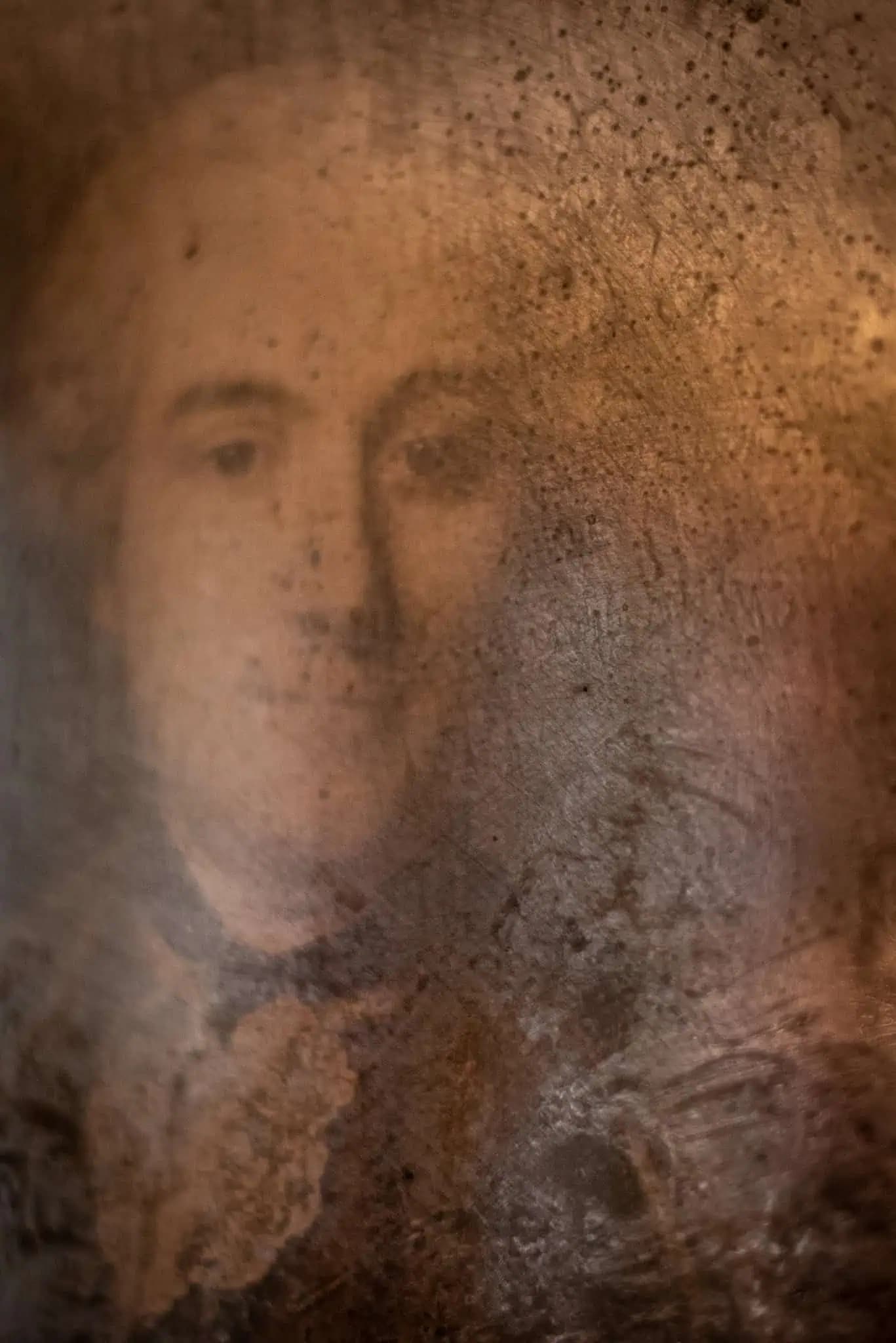 Aged portrait artwork detail inside Luxurious Home.