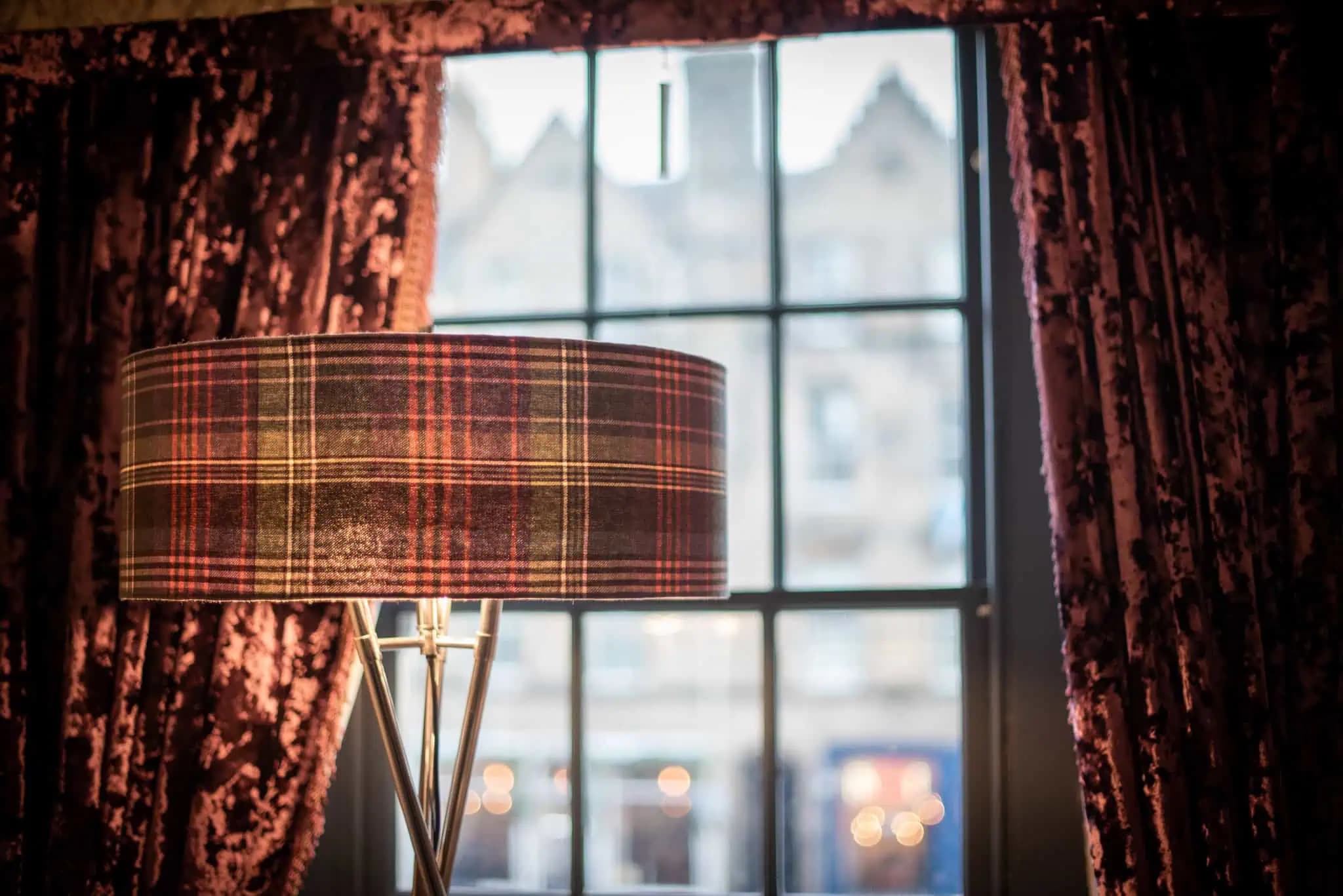 Tartan lamp beside a window inside Luxurious Home.