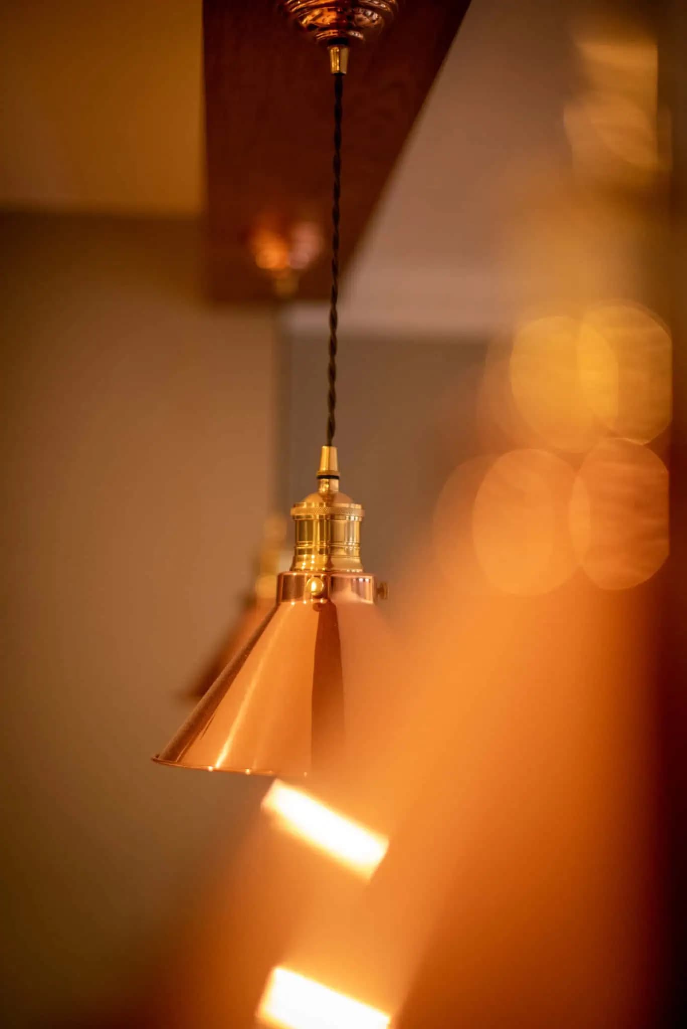 Copper pendant light detail inside Luxurious Home.