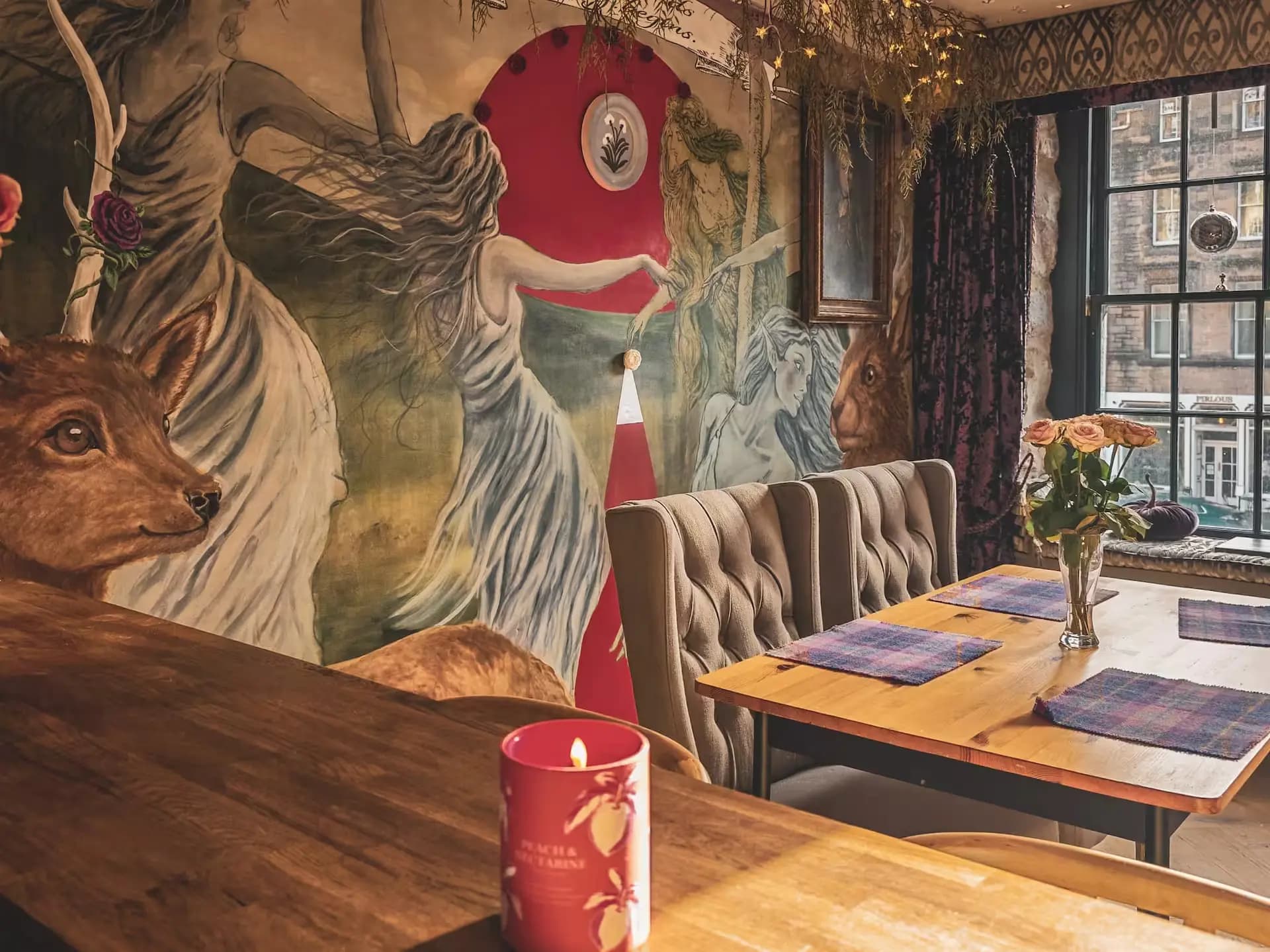Dining table and mural wall beside the kitchen inside Luxurious Home.