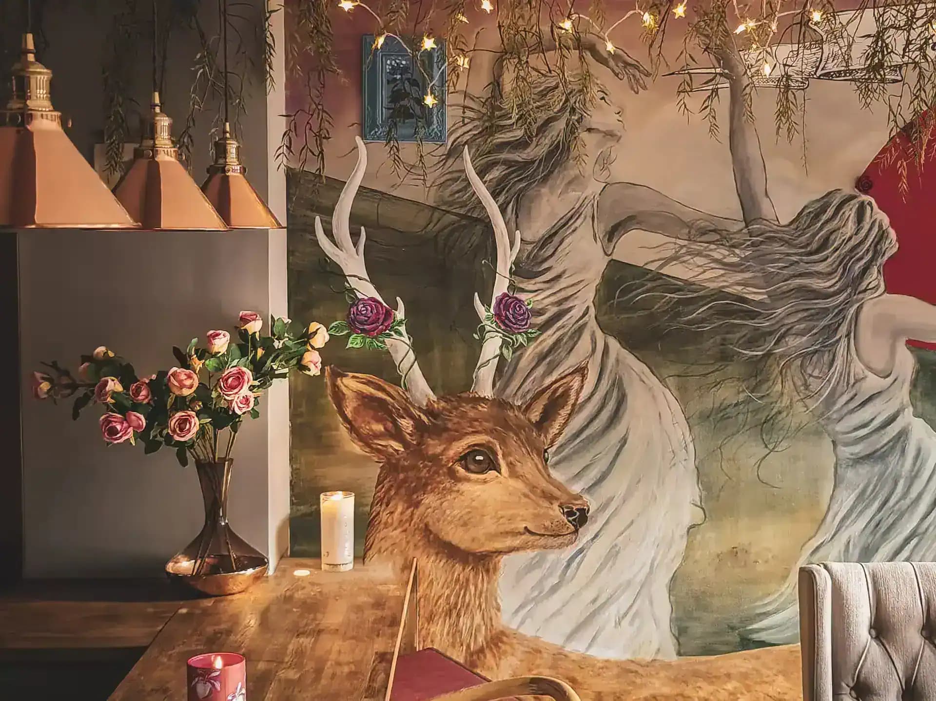 Dining table below the mural wall inside Luxurious Home.