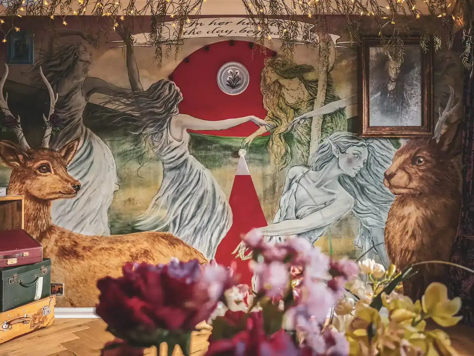 Flowers set in front of the mural wall inside Luxurious Home.